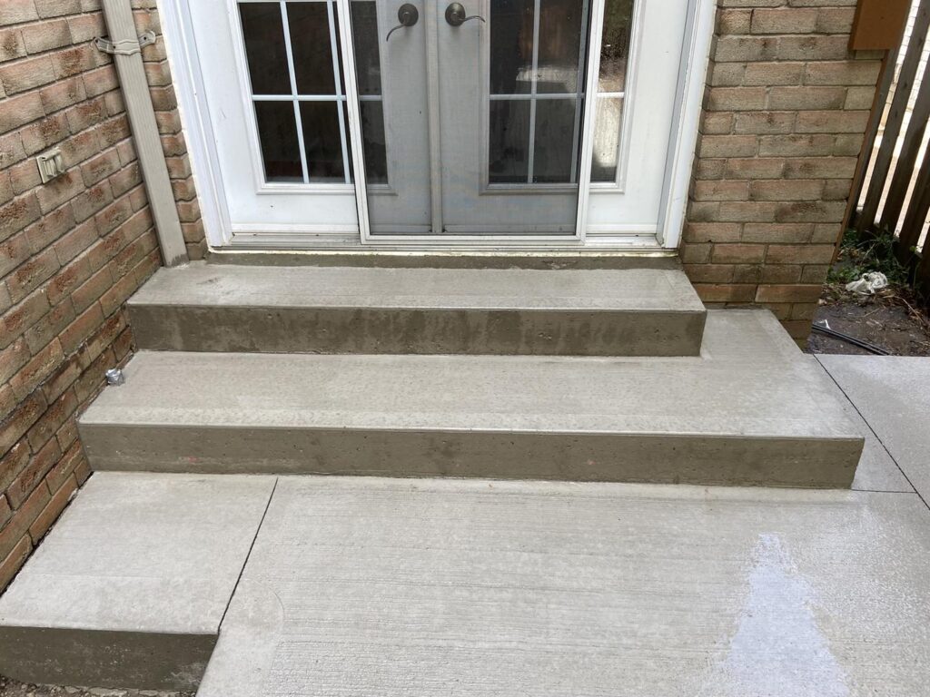 This image has an empty alt attribute; its file name is Patio-Concrete-stairs-1024x768.jpeg